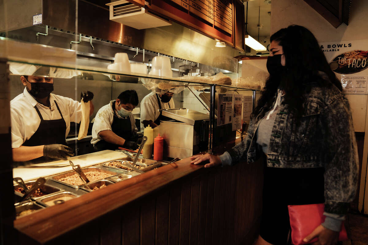 SFGATE's burrito reviewer, Cecilia Peña-Govea, aka La Doña, orders food at Gordo Taqueria on Geary Boulevard.