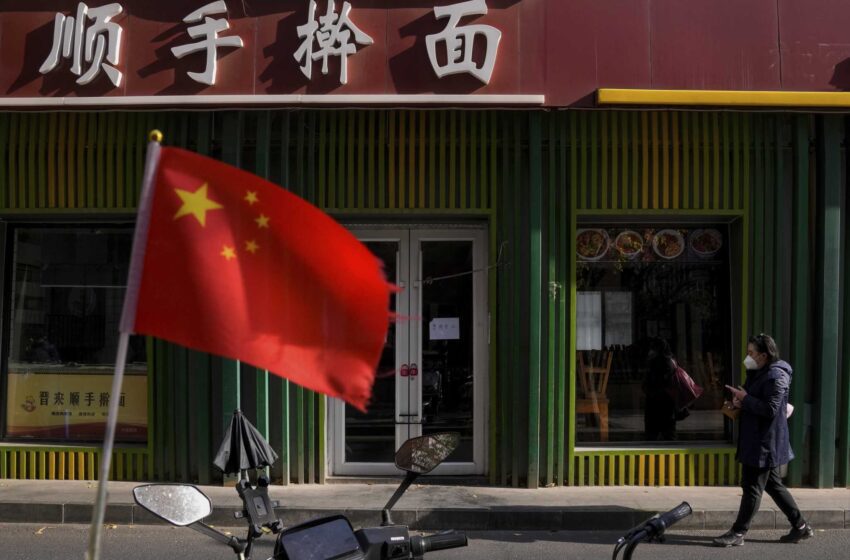  AP PHOTOS: La vida de Pekín en suspenso por los cierres y las pruebas de COVID